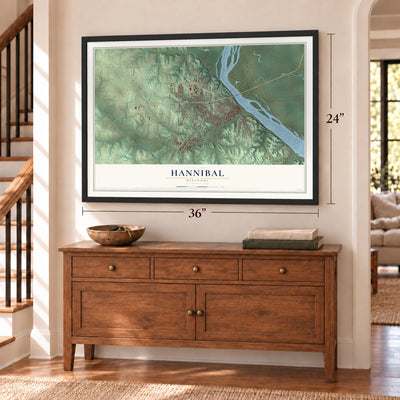 Hannibal, Missouri map, 24 x 36 inch print in a black frame above a dresser by a staircase