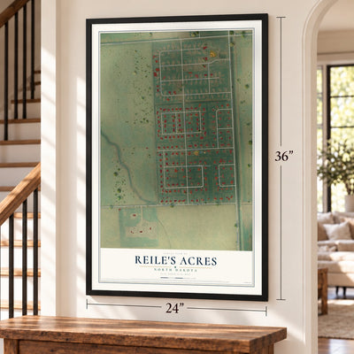 Reile's Acres, North Dakota map, 24 x 36 inch print in a black frame by a staircase