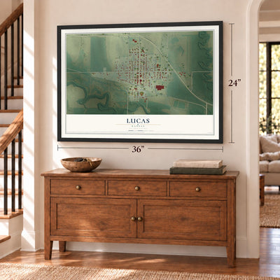 Lucas, Kansas map, 24 x 36 inch print in a black frame above a dresser by a staircase