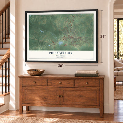 Philadelphia, Mississippi map, 24 x 36 inch print in a black frame above a dresser by a staircase