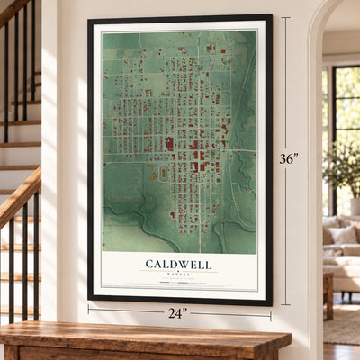 Caldwell, Kansas map, 24 x 36 inch print in a black frame by a staircase