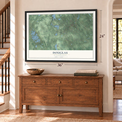 Douglas, Massachusetts map, 24 x 36 inch print in a black frame above a dresser by a staircase