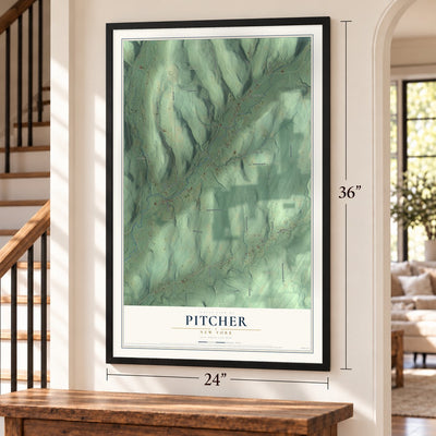 Pitcher, New York map, 24 x 36 inch print in a black frame by a staircase