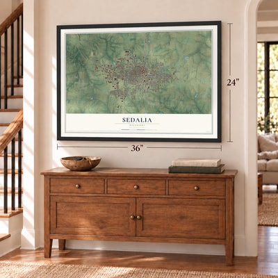 Sedalia, Missouri map, 24 x 36 inch print in a black frame above a dresser by a staircase