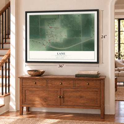 Lane, South Dakota map, 24 x 36 inch print in a black frame above a dresser by a staircase