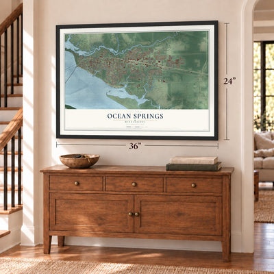 Ocean Springs, Mississippi map, 24 x 36 inch print in a black frame above a dresser by a staircase