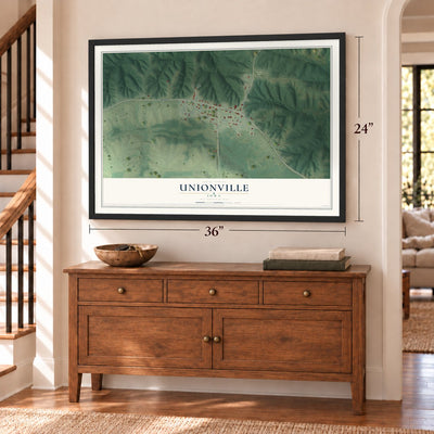 Unionville, Iowa map, 24 x 36 inch print in a black frame above a dresser by a staircase