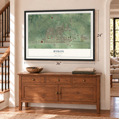 Byron, Minnesota map, 24 x 36 inch print in a black frame above a dresser by a staircase