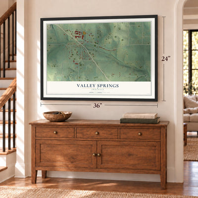Valley Springs, Arkansas map, 24 x 36 inch print in a black frame above a dresser by a staircase