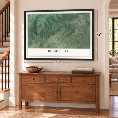 Hobson City, Alabama map, 24 x 36 inch print in a black frame above a dresser by a staircase