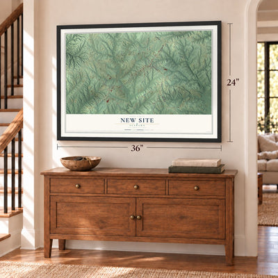 New Site, Alabama map, 24 x 36 inch print in a black frame above a dresser by a staircase
