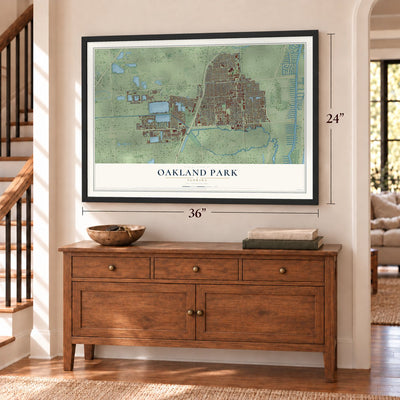 Oakland Park, Florida map, 24 x 36 inch print in a black frame above a dresser by a staircase