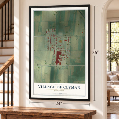 Clyman, Wisconsin map, 24 x 36 inch print in a black frame by a staircase