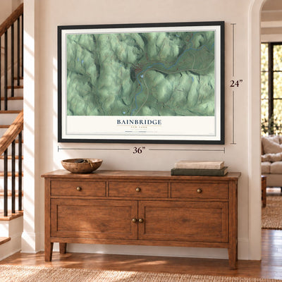 Bainbridge, New York map, 24 x 36 inch print in a black frame above a dresser by a staircase