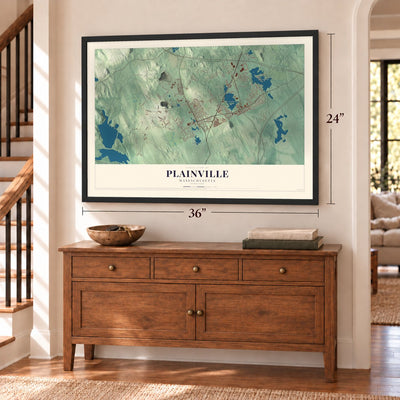 Plainville, Massachusetts map, 24 x 36 inch print in a black frame above a dresser by a staircase