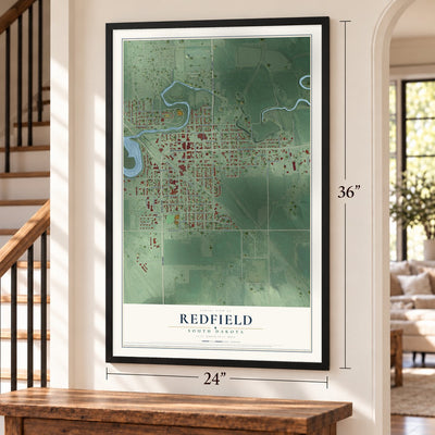 Redfield, South Dakota map, 24 x 36 inch print in a black frame by a staircase