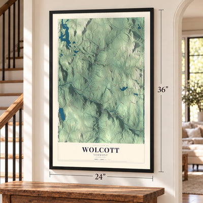 Wolcott, Vermont map, 24 x 36 inch print in a black frame by a staircase