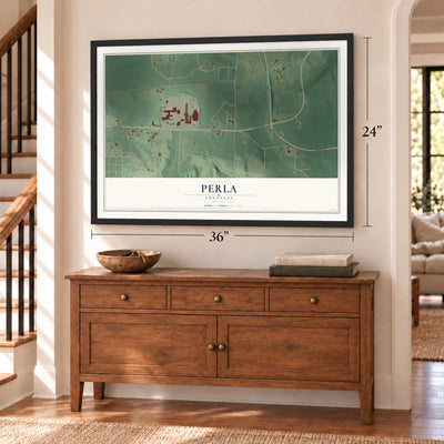 Perla, Arkansas map, 24 x 36 inch print in a black frame above a dresser by a staircase