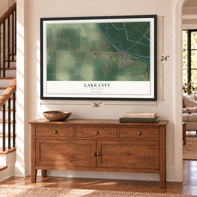 Lake City, Arkansas map, 24 x 36 inch print in a black frame above a dresser by a staircase