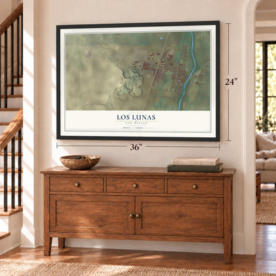 Los Lunas, New Mexico map, 24 x 36 inch print in a black frame above a dresser by a staircase