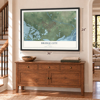 Bridge City, Texas map, 24 x 36 inch print in a black frame above a dresser by a staircase