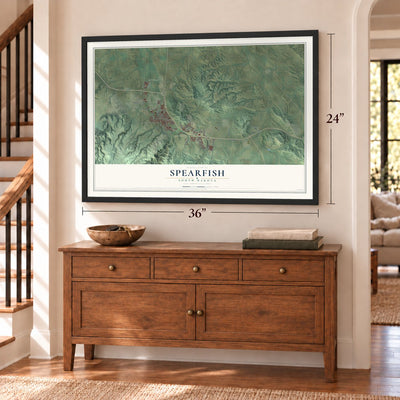 Spearfish, South Dakota map, 24 x 36 inch print in a black frame above a dresser by a staircase