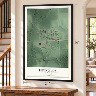 Reynolds, Nebraska map, 24 x 36 inch print in a black frame by a staircase