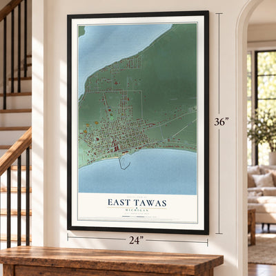 East Tawas, Michigan map, 24 x 36 inch print in a black frame by a staircase