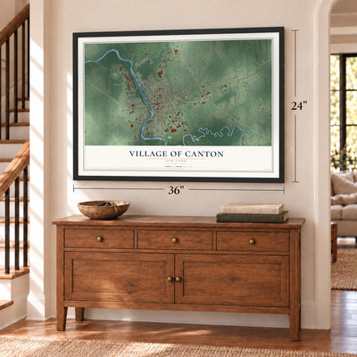 Village of Canton, New York map, 24 x 36 inch print in a black frame above a dresser by a staircase