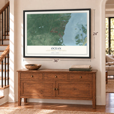Ocean, Ocean County, New Jersey map, 24 x 36 inch print in a black frame above a dresser by a staircase