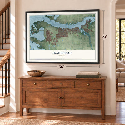 Bradenton, Florida map, 24 x 36 inch print in a black frame above a dresser by a staircase