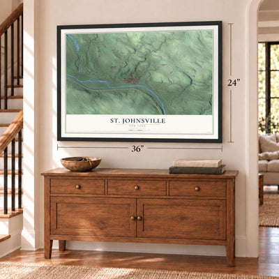 St. Johnsville, New York map, 24 x 36 inch print in a black frame above a dresser by a staircase