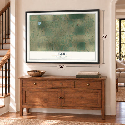 Calio, North Dakota map, 24 x 36 inch print in a black frame above a dresser by a staircase
