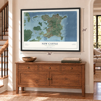 New Castle, New Hampshire map, 24 x 36 inch print in a black frame above a dresser by a staircase