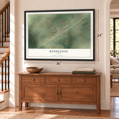 Kendleton, Texas map, 24 x 36 inch print in a black frame above a dresser by a staircase
