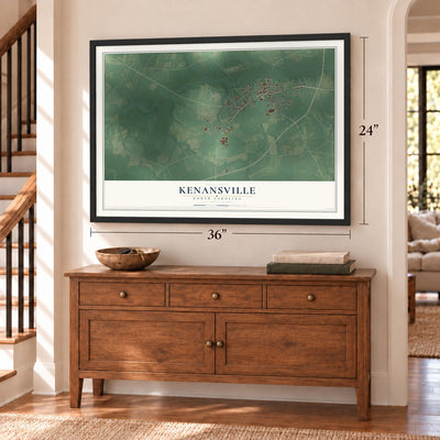 Kenansville, North Carolina map, 24 x 36 inch print in a black frame above a dresser by a staircase