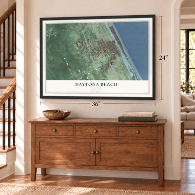 Daytona Beach, Florida map, 24 x 36 inch print in a black frame above a dresser by a staircase