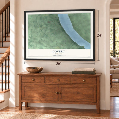 Covert, New York map, 24 x 36 inch print in a black frame above a dresser by a staircase
