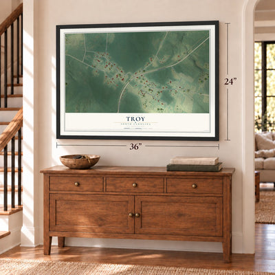 Troy, South Carolina map, 24 x 36 inch print in a black frame above a dresser by a staircase
