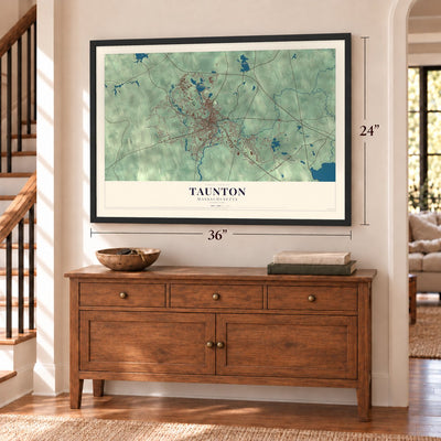 Taunton, Massachusetts map, 24 x 36 inch print in a black frame above a dresser by a staircase