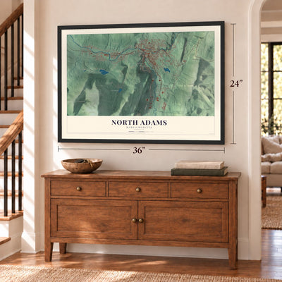 North Adams, Massachusetts map, 24 x 36 inch print in a black frame above a dresser by a staircase