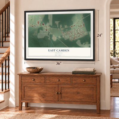 East Camden, Arkansas map, 24 x 36 inch print in a black frame above a dresser by a staircase