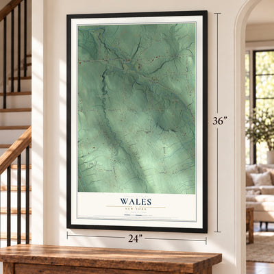 Wales, New York map, 24 x 36 inch print in a black frame by a staircase