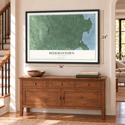 Beekmantown, New York map, 24 x 36 inch print in a black frame above a dresser by a staircase