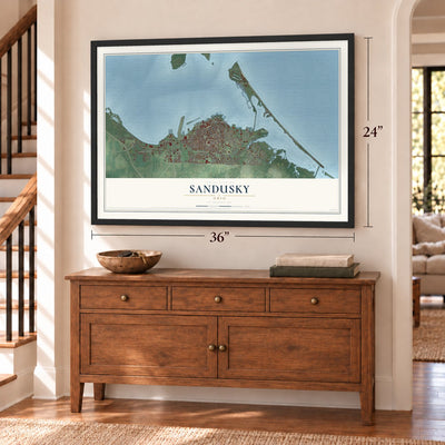 Sandusky, Ohio map, 24 x 36 inch print in a black frame above a dresser by a staircase