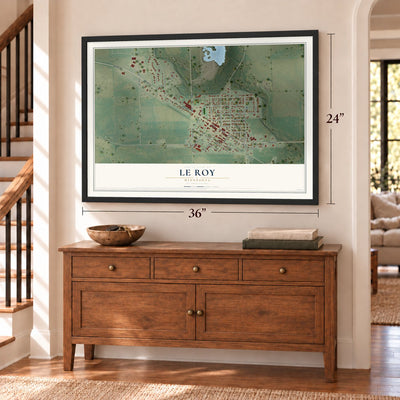 Le Roy, Minnesota map, 24 x 36 inch print in a black frame above a dresser by a staircase