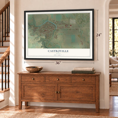 Castroville, Texas map, 24 x 36 inch print in a black frame above a dresser by a staircase