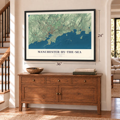 Manchester-by-the-Sea, Massachusetts map, 24 x 36 inch print in a black frame above a dresser by a staircase