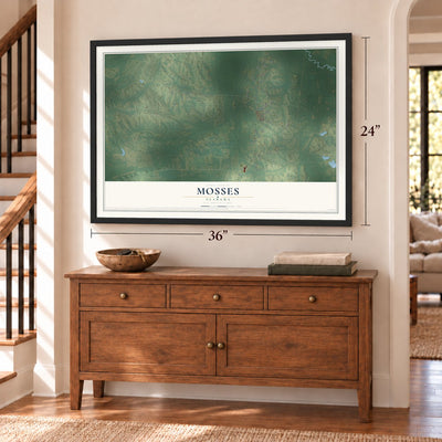 Mosses, Alabama map, 24 x 36 inch print in a black frame above a dresser by a staircase
