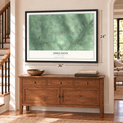Sheldon, New York map, 24 x 36 inch print in a black frame above a dresser by a staircase